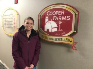 ntf intern in front of a sign